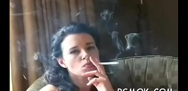  Gorgeous girl takes pleasure in some reading and smoking